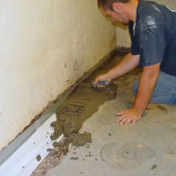 Testing a French drain system in a Lehman home.