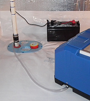 Closeup of a crawl space sump pump installed in Dingman
