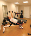 a basement gym and workout room with a wood laminate flooring, installed in Phillipsburg, NJ & PA