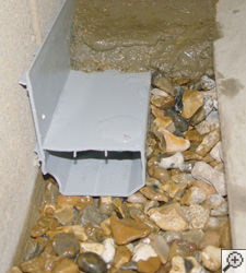 A no-clog basement french drain system installed in Dingman